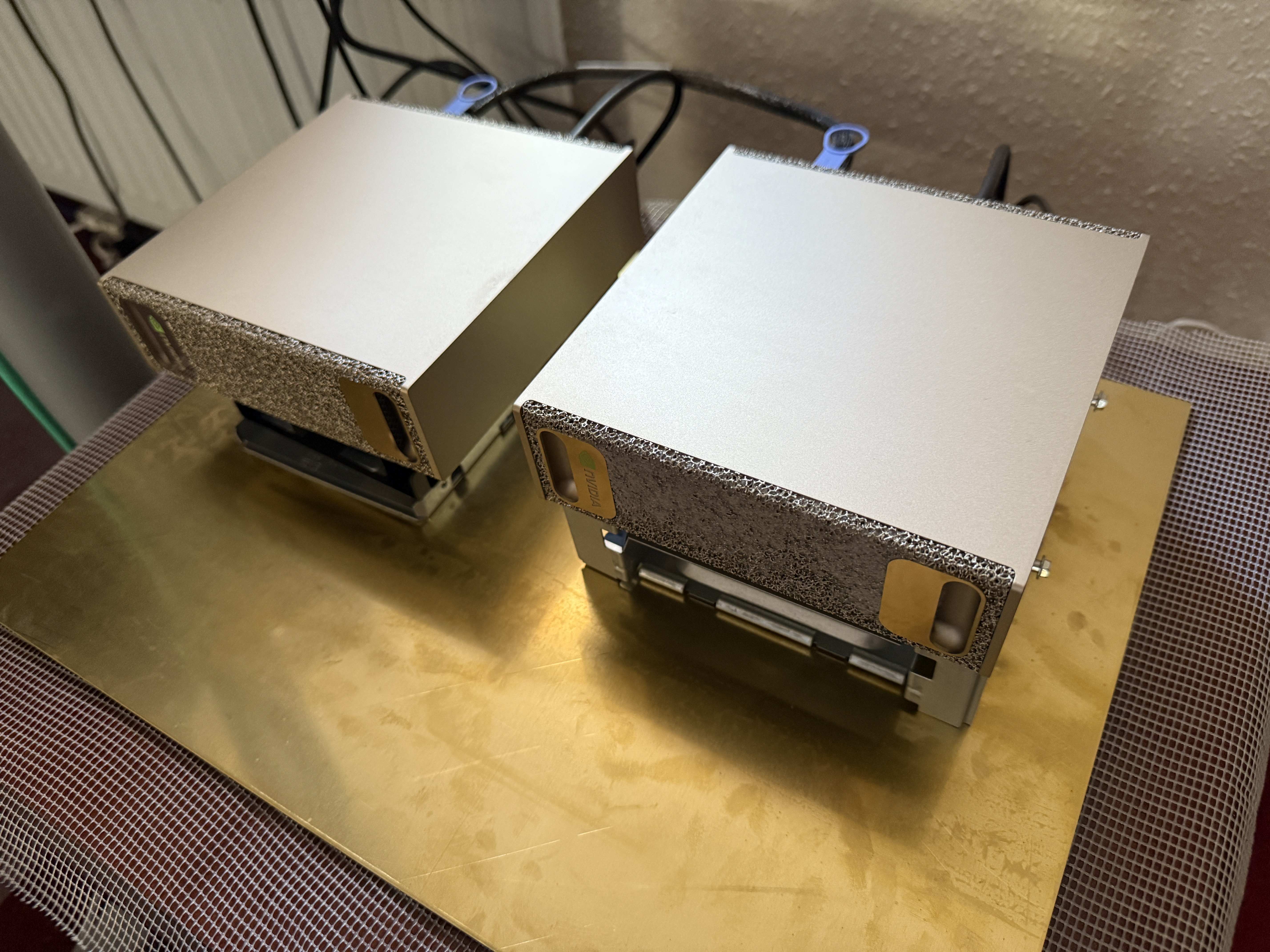 Two NVIDIA DGX Sparks side-by-side connected via a QSFP112 cable